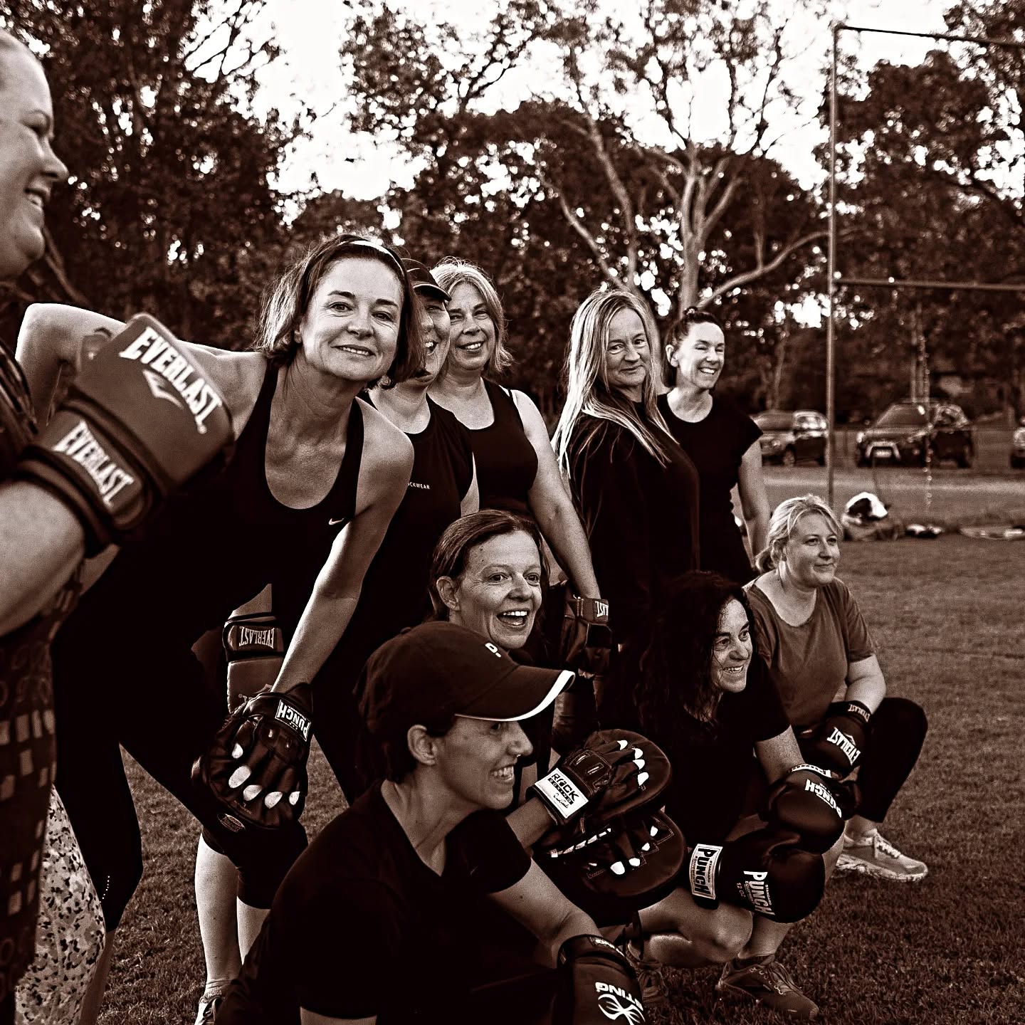 Women boxing together during group training in Canberra