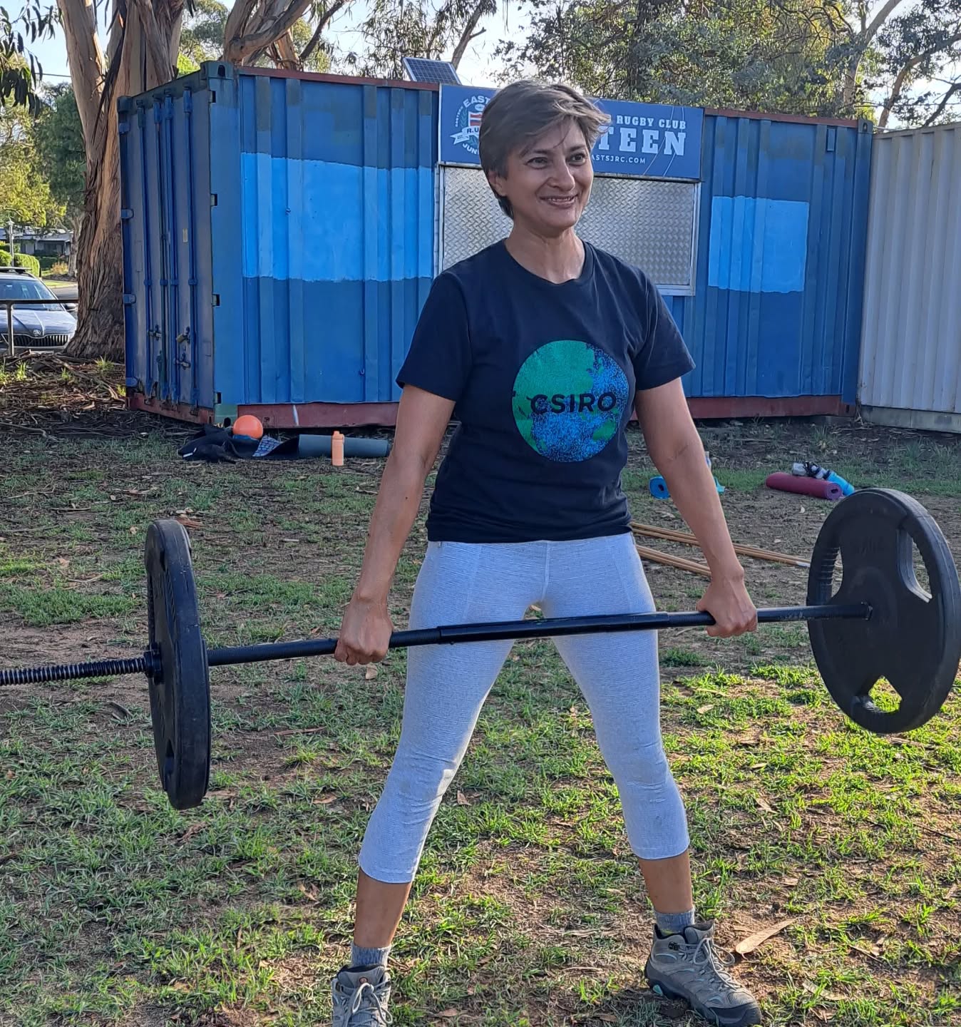 Women's strength training with a barbell in Canberra