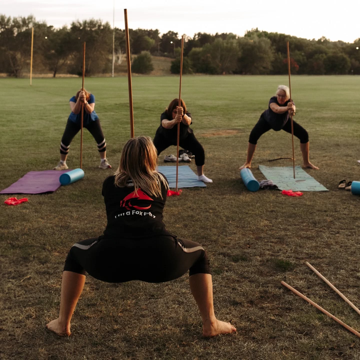 Small group of women training together with a female personal trainer in Canberra